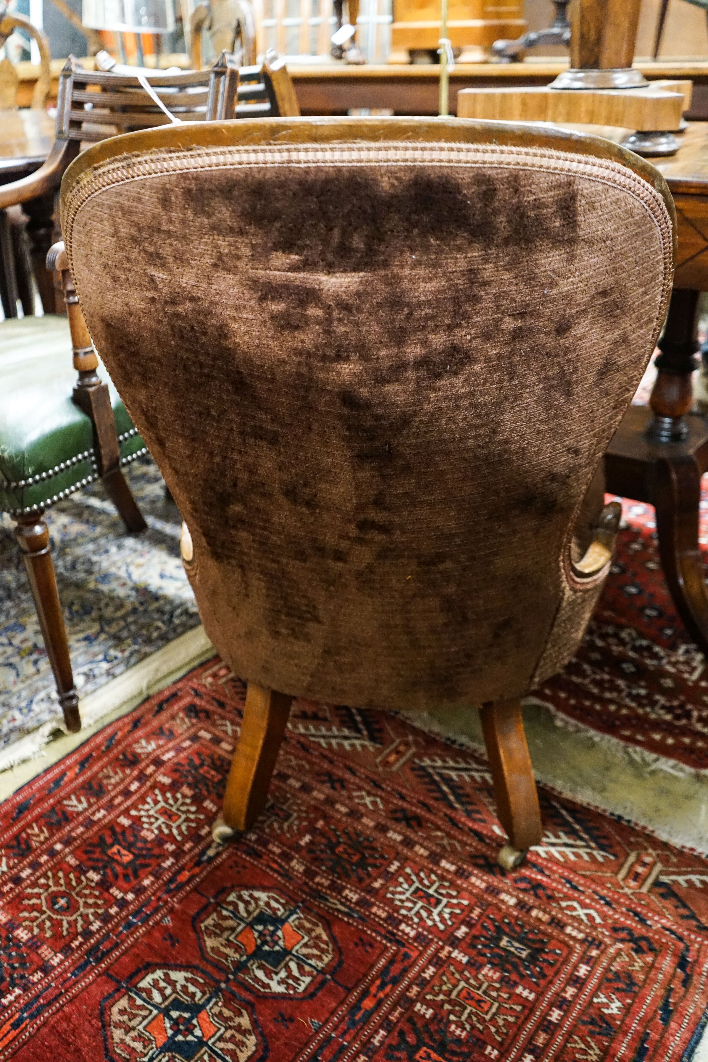 A Victorian mahogany spoonback nursing chair